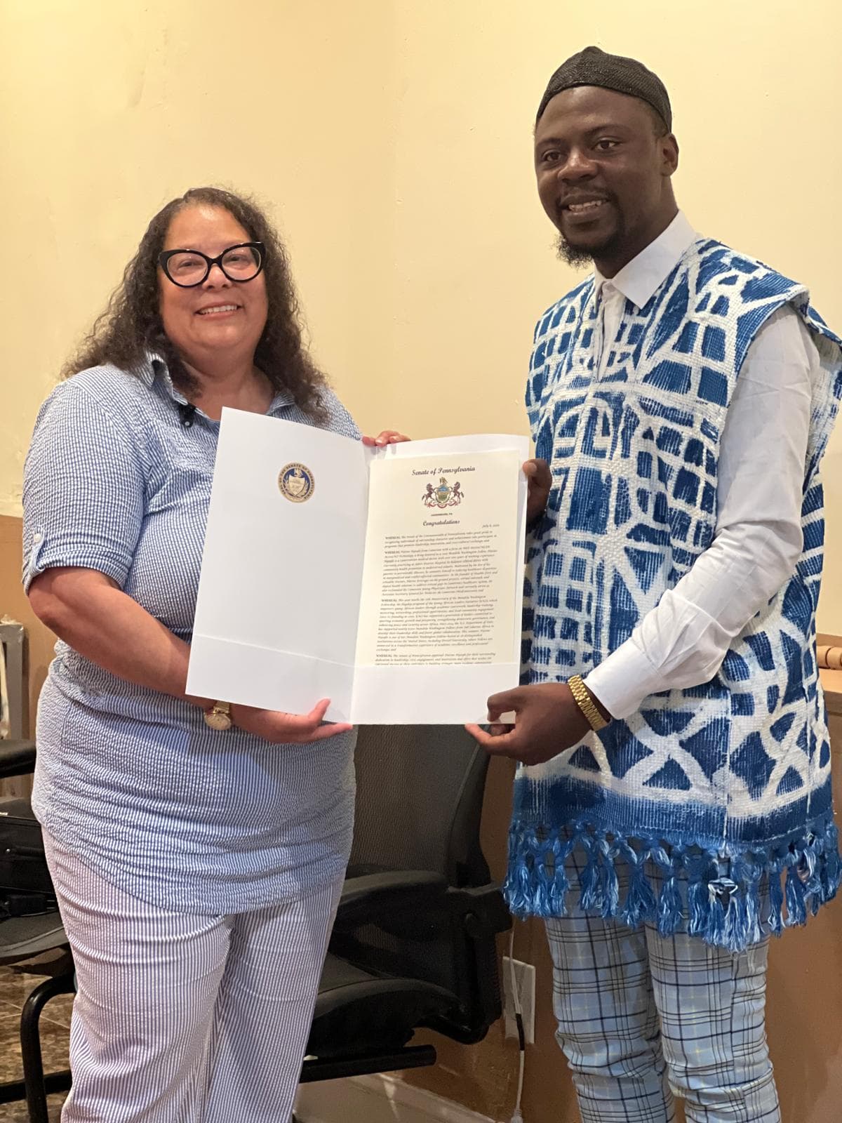 Dr. Platine Nyuyki receiving a citation from the Governor of Philadelphia, USA 2025